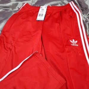 Red adidas sweat pants